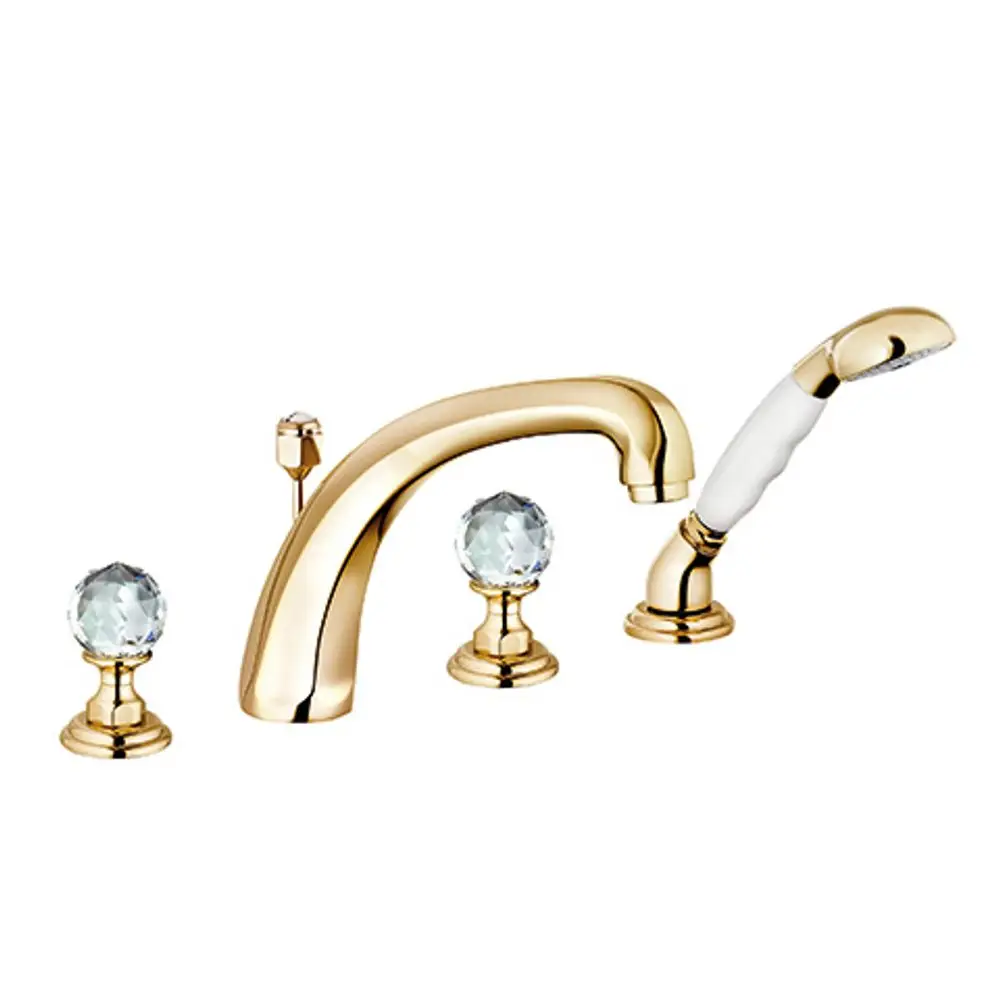 Armatur in Gold von Kludi mit versenkbarer Handbrause, ausgestattet mit zwei Bedienknöpfen mit Kristalloptik und einem geschwungenen Wasserhahn.